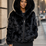 Calvere Furs Women's Fox Bomber Jacket with Hood in Black, worn