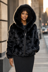 Calvere Furs Women's Fox Bomber Jacket with Hood in Black, worn
